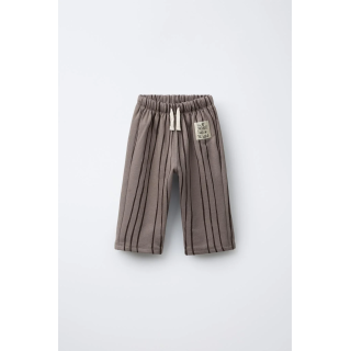 БРЮКИ В ПОЛОСКУ С НАШИВКОЙ