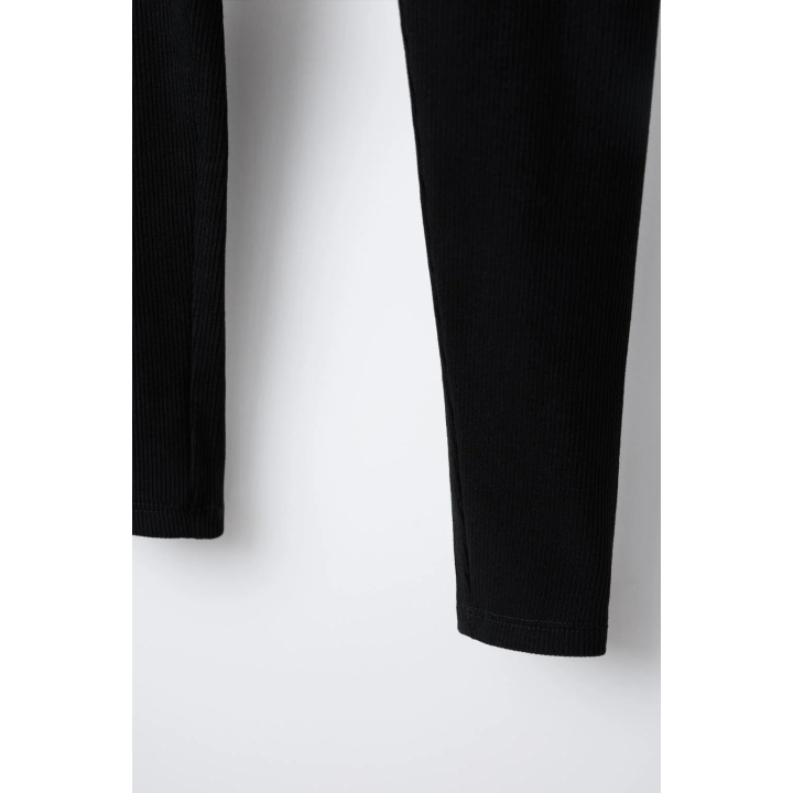 ЛЕГИНСЫ В РУБЧИК С ЭТИКЕТКОЙ