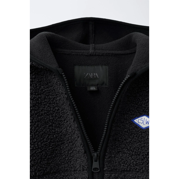 КУРТКА ИЗ ИСКУССТВЕННОЙ ОВЧИНЫ С КАПЮШОНОМ