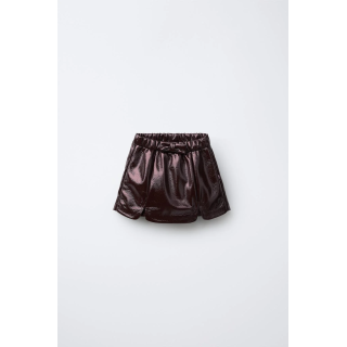 ЮБКА-ШОРТЫ ИЗ ЛАКОВОЙ КОЖИ С БАНТОМ