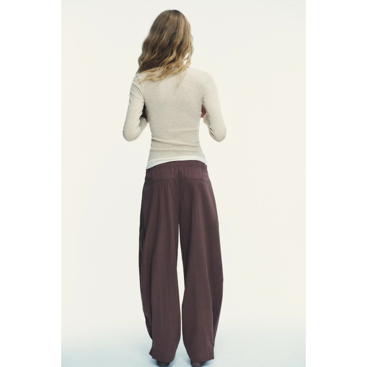 НЕЙЛОНОВЫЕ БРЮКИ С ПУГОВИЦАМИ СНИЗУ