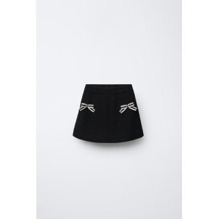 ТРИКОТАЖНАЯ ЮБКА С БАНТИКАМИ