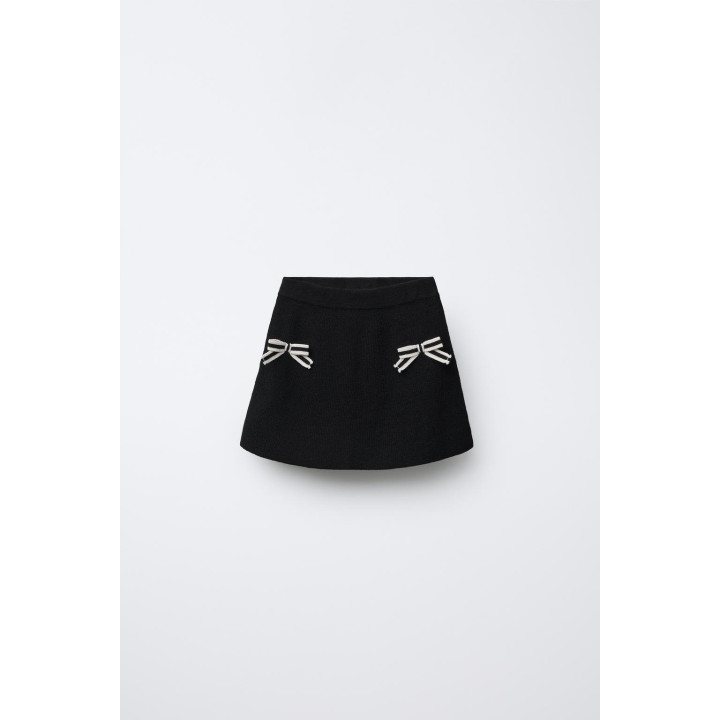 ТРИКОТАЖНАЯ ЮБКА С БАНТИКАМИ