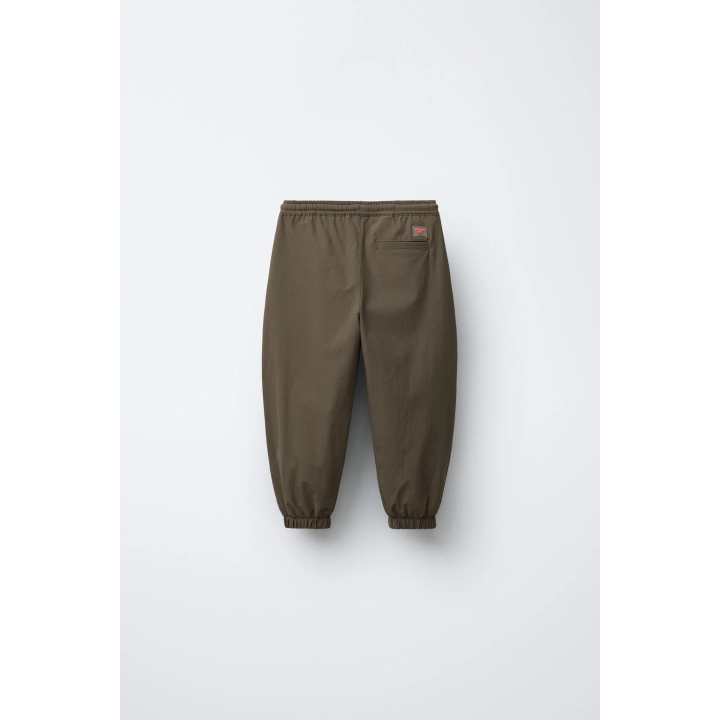 БРЮКИ-ДЖОГГЕРЫ ИЗ ВЫСОКОТЕХНОЛОГИЧНОЙ ТКАНИ