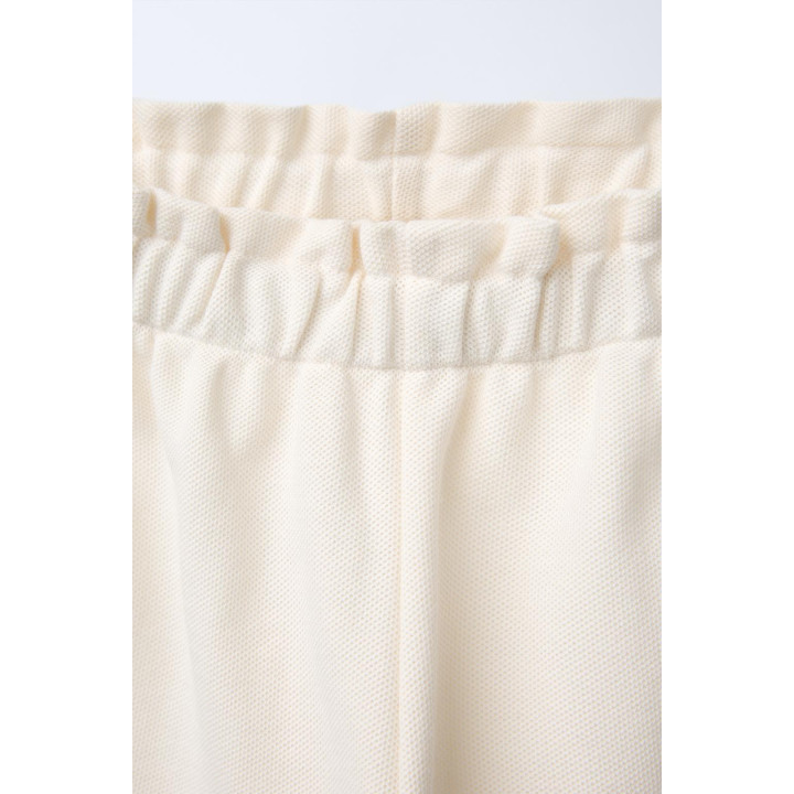 ПРЯМЫЕ БРЮКИ С ВОЛНИСТОЙ ОТДЕЛКОЙ