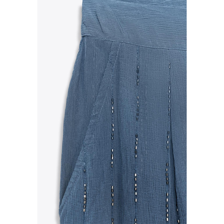 Брюки с бисером и завязками на подворотах