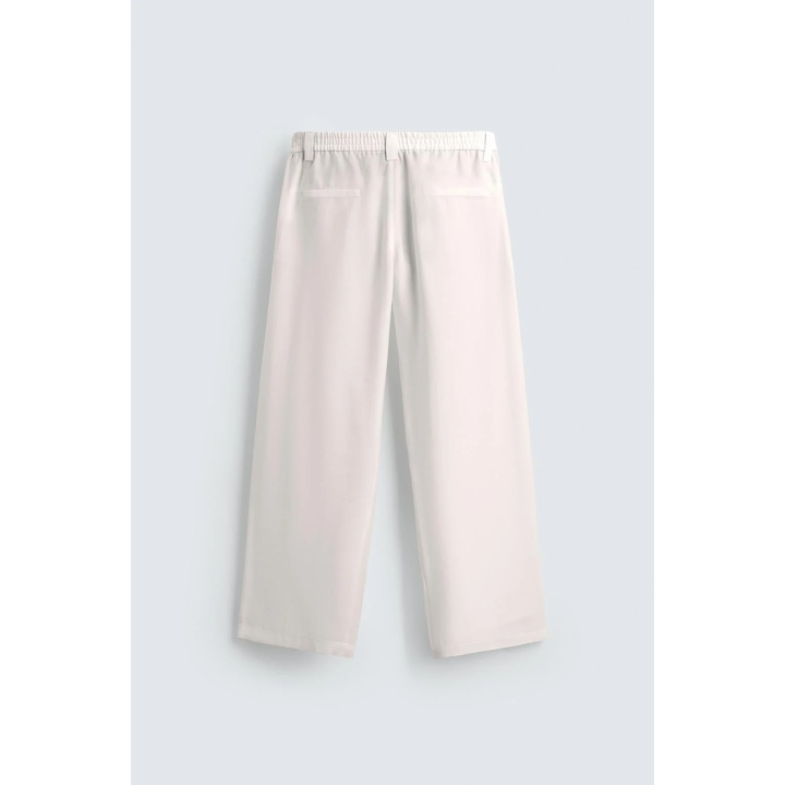 БРЮКИ ИЗ СТРУЯЩЕЙСЯ ТКАНИ СО СКЛАДКАМИ ПО БОКАМ