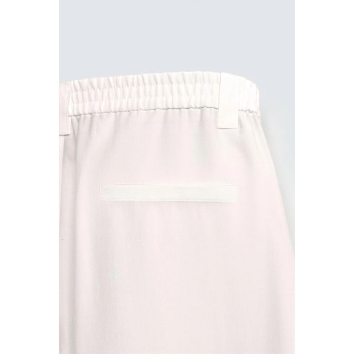 БРЮКИ ИЗ СТРУЯЩЕЙСЯ ТКАНИ СО СКЛАДКАМИ ПО БОКАМ