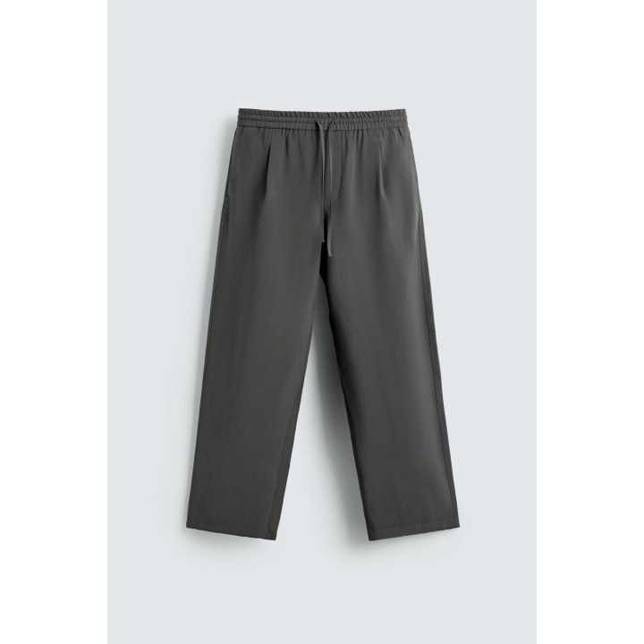 СТРУЯЩИЕСЯ БРЮКИ С ОТДЕЛОЧНОЙ СТРОЧКОЙ