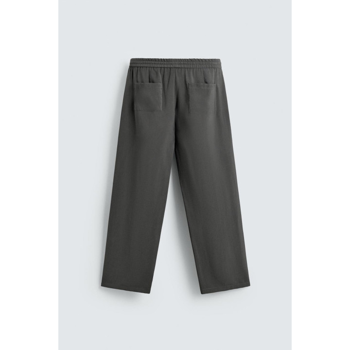 СТРУЯЩИЕСЯ БРЮКИ С ОТДЕЛОЧНОЙ СТРОЧКОЙ