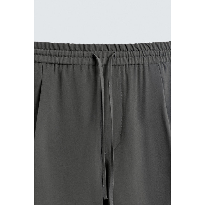 СТРУЯЩИЕСЯ БРЮКИ С ОТДЕЛОЧНОЙ СТРОЧКОЙ