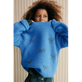 ТРИКОТАЖНЫЙ ДЖЕМПЕР С БУСИНАМИ, БАНТАМИ И БЛЕСТКАМИ