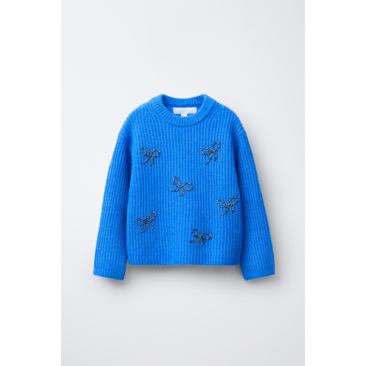 ТРИКОТАЖНЫЙ ДЖЕМПЕР С БУСИНАМИ, БАНТАМИ И БЛЕСТКАМИ