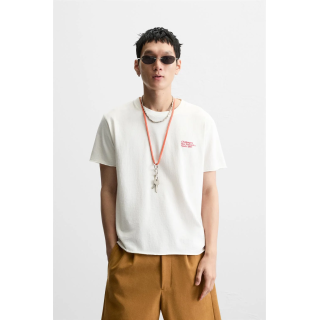 ФУТБОЛКА ИЗ ТКАНИ С ЭФФЕКТОМ ПОТЕРТОСТИ С НАДПИСЬЮ