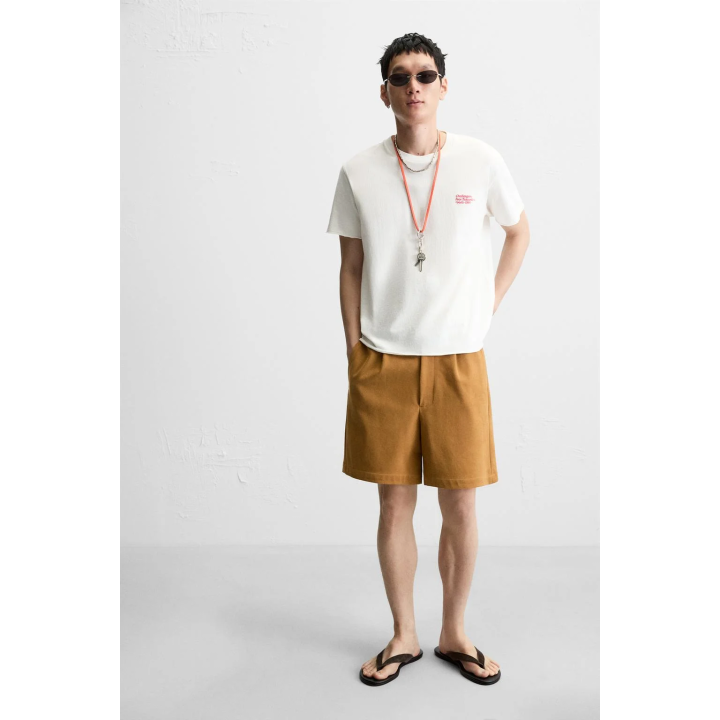 ФУТБОЛКА ИЗ ТКАНИ С ЭФФЕКТОМ ПОТЕРТОСТИ С НАДПИСЬЮ