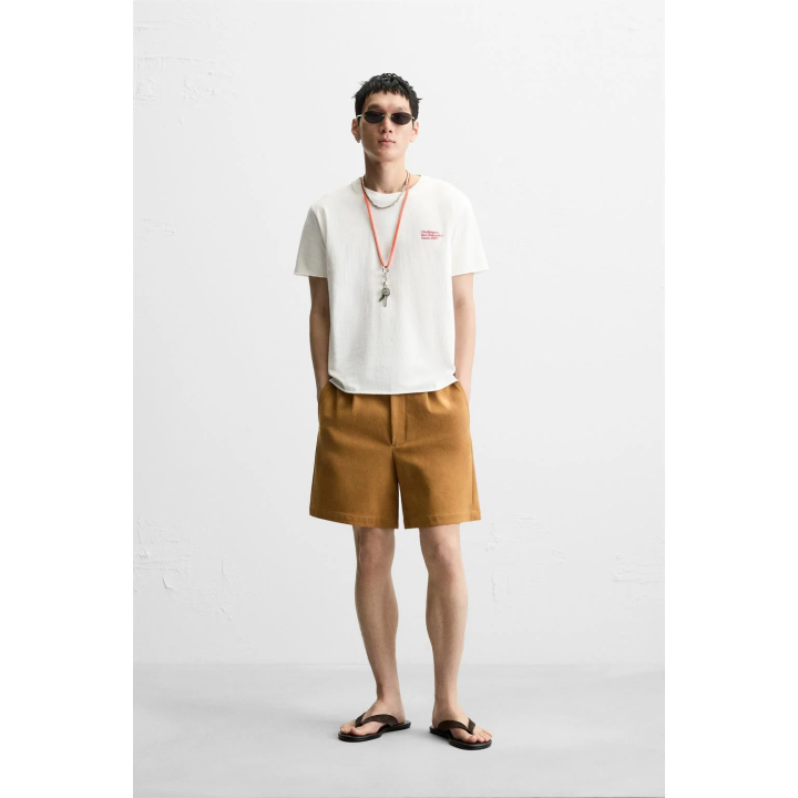 ФУТБОЛКА ИЗ ТКАНИ С ЭФФЕКТОМ ПОТЕРТОСТИ С НАДПИСЬЮ