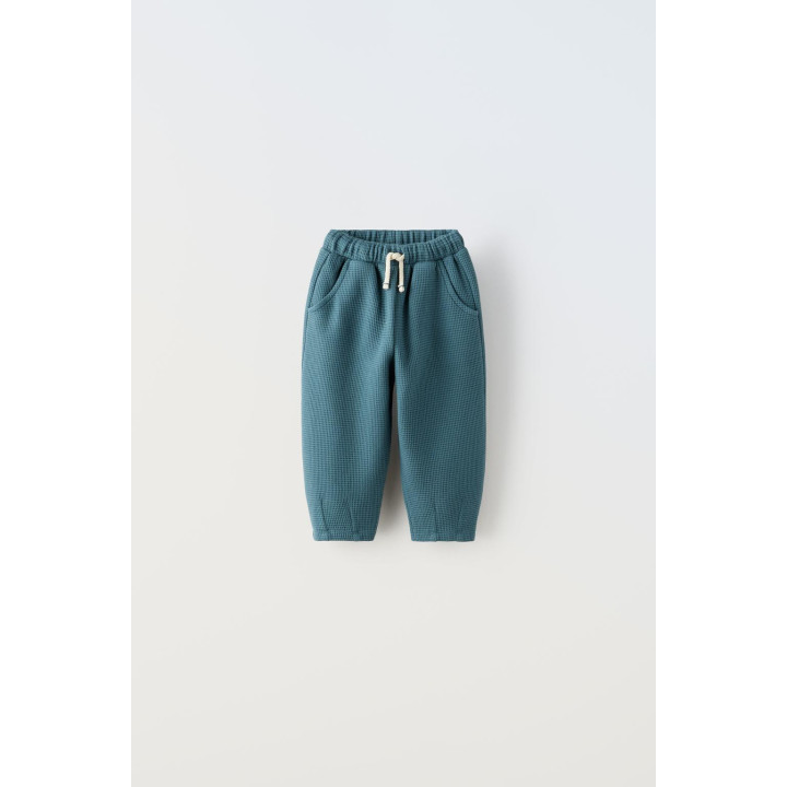 БРЮКИ ИЗ РИФЛЕНОЙ ТКАНИ