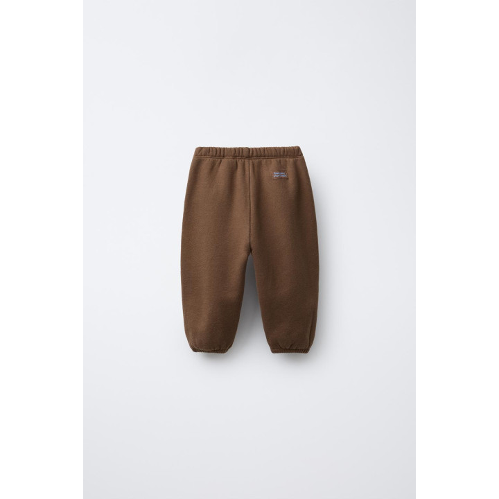 БРЮКИ-ДЖОГГЕРЫ С ЭТИКЕТКОЙ