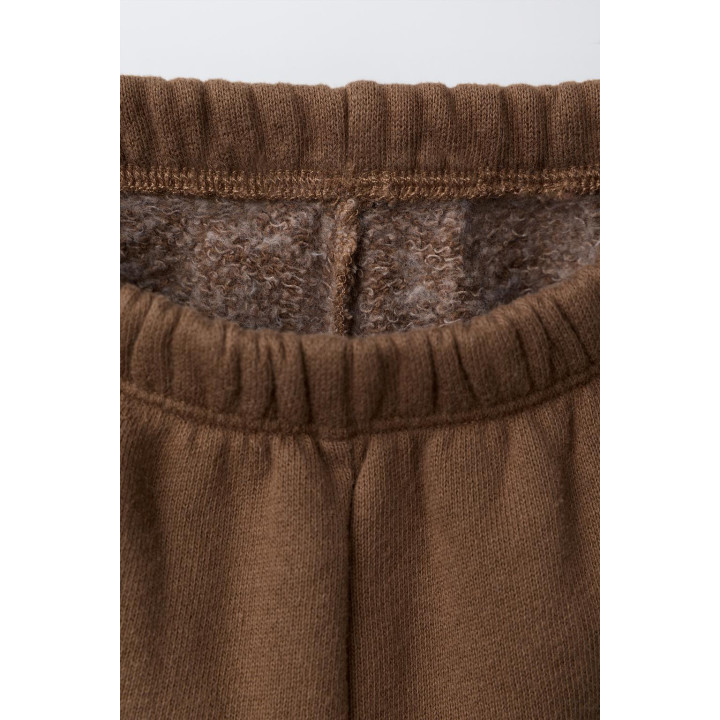 БРЮКИ-ДЖОГГЕРЫ С ЭТИКЕТКОЙ