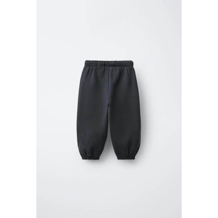 БРЮКИ-ДЖОГГЕРЫ С ТЕКСТОВЫМ ФЛОКОМ