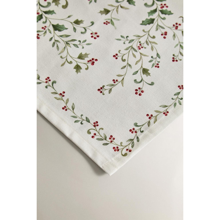 Рождественский бегунок по столу с листьями остролиста