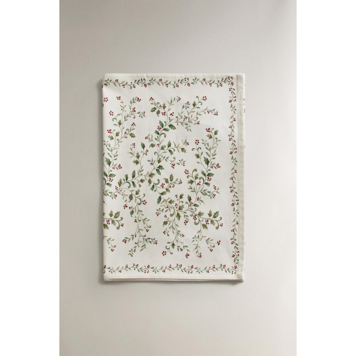 Рождественский бегунок по столу с листьями остролиста