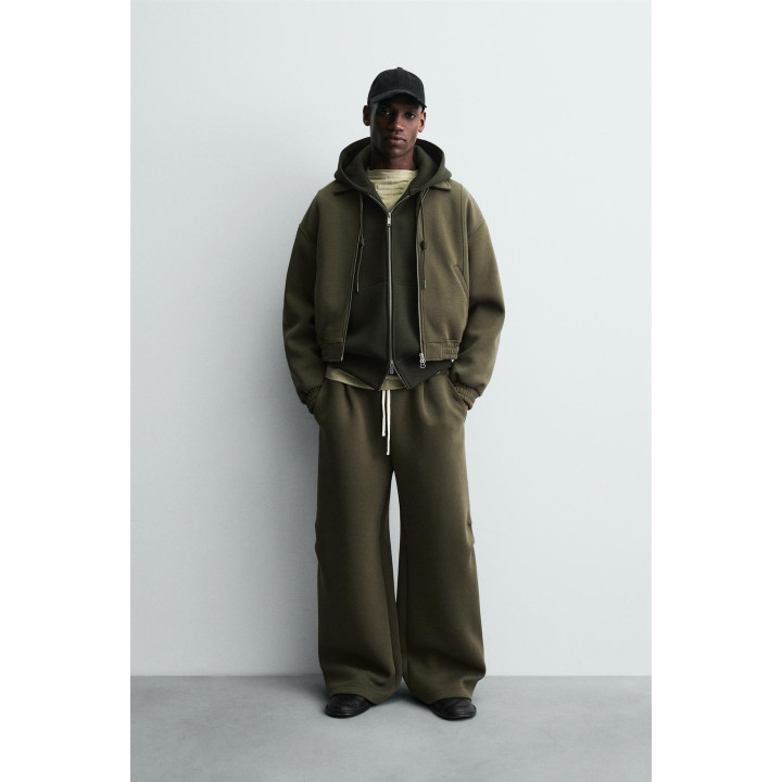 ШИРОКИЕ БРЮКИ ИЗ НЕОПРЕНА С ЗАКЛЕПКАМИ