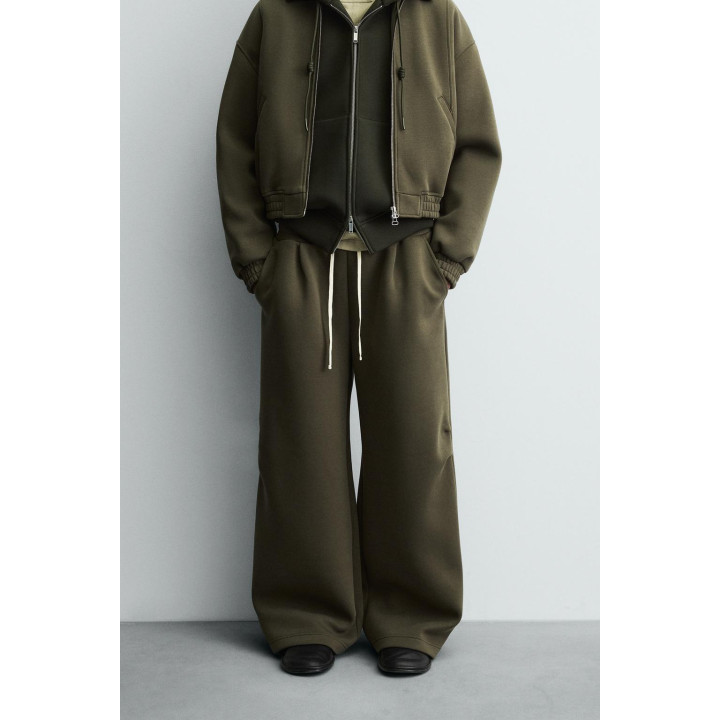 ШИРОКИЕ БРЮКИ ИЗ НЕОПРЕНА С ЗАКЛЕПКАМИ