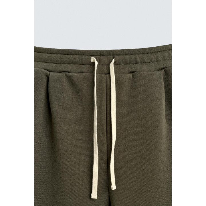 ШИРОКИЕ БРЮКИ ИЗ НЕОПРЕНА С ЗАКЛЕПКАМИ