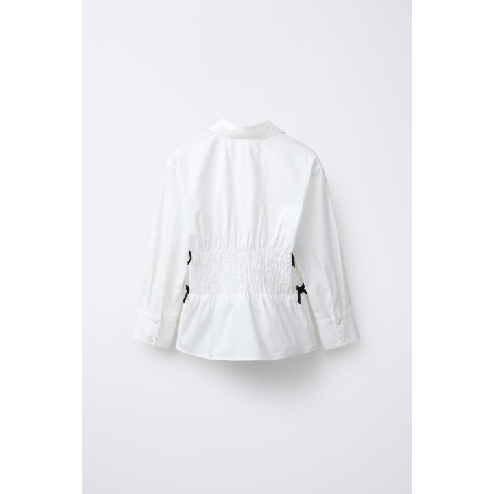 РУБАШКА С ЭЛАСТИЧНОЙ ОТДЕЛКОЙ И КОНТРАСТНЫМИ БАНТАМИ