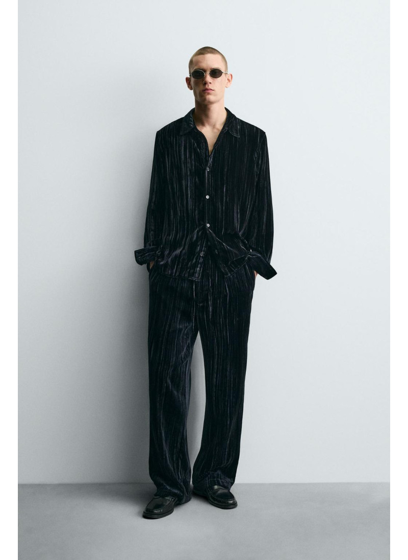 Брюки из вельвета с защипам...