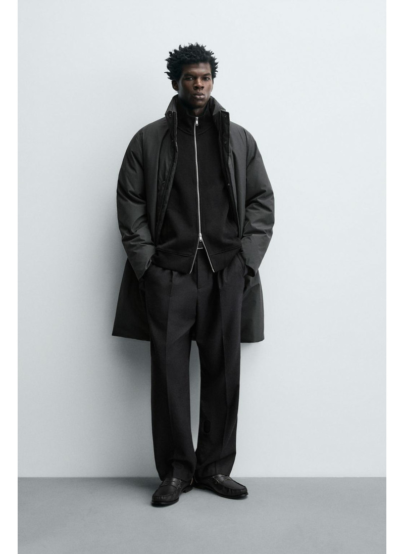 Длинный стеганый пуховик