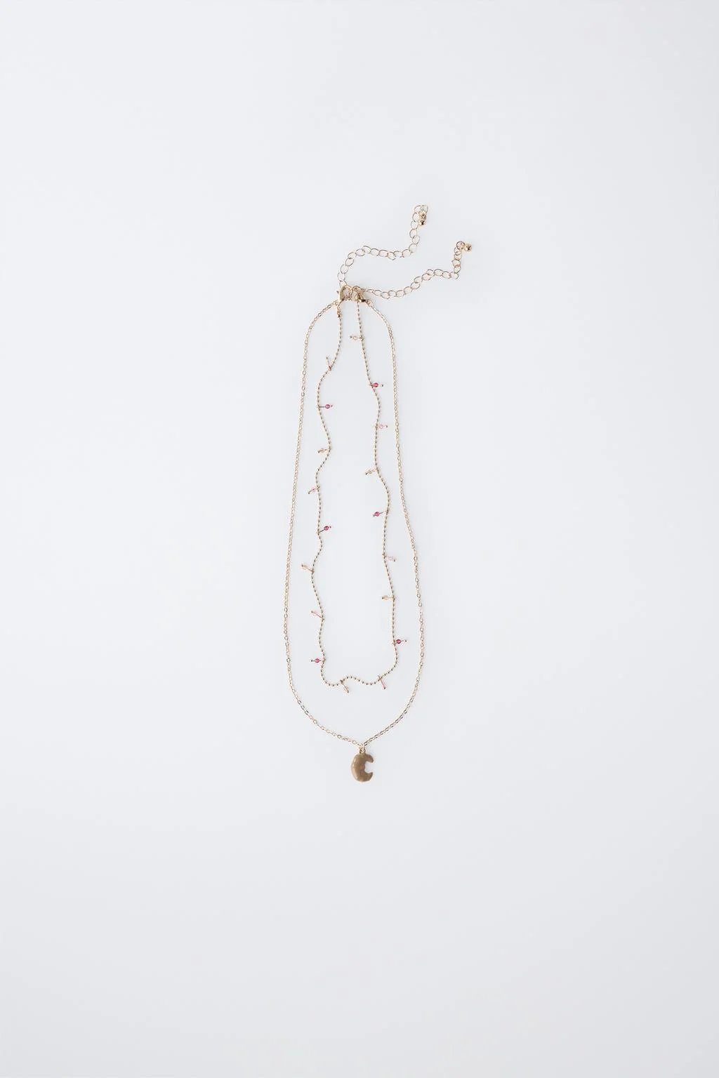 Набор из двух кулонов в форме круассана — Брюски