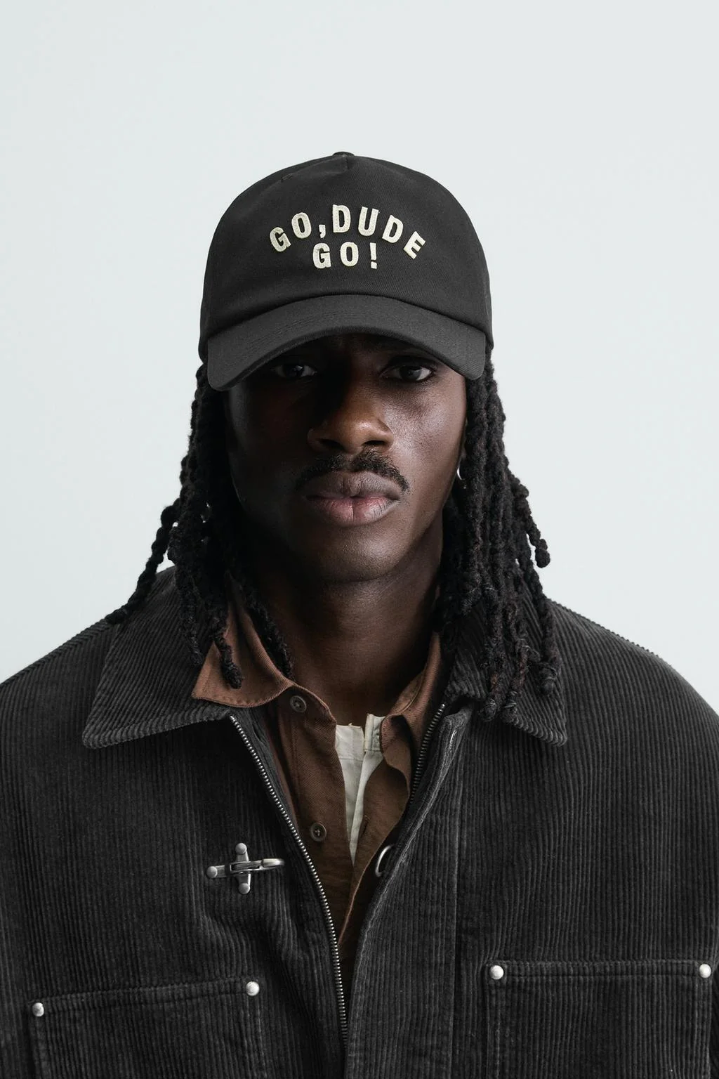 CAP WITH EMBROIDERED SLOGAN