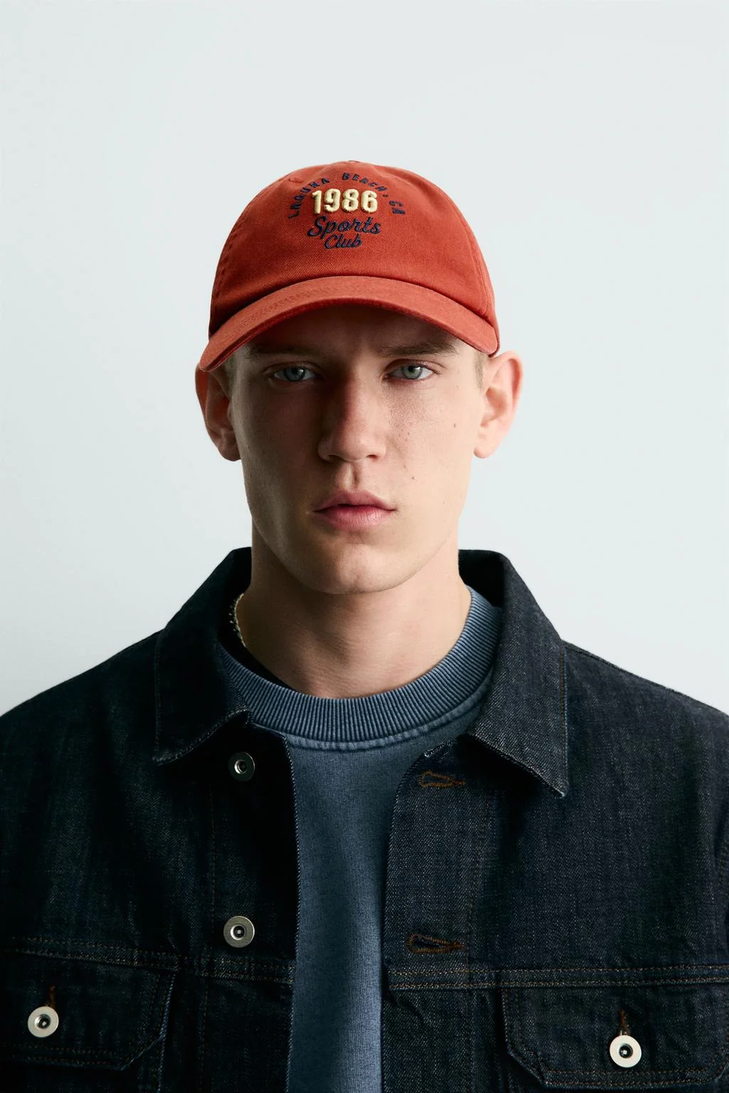 CAP WITH EMBROIDERED SLOGAN