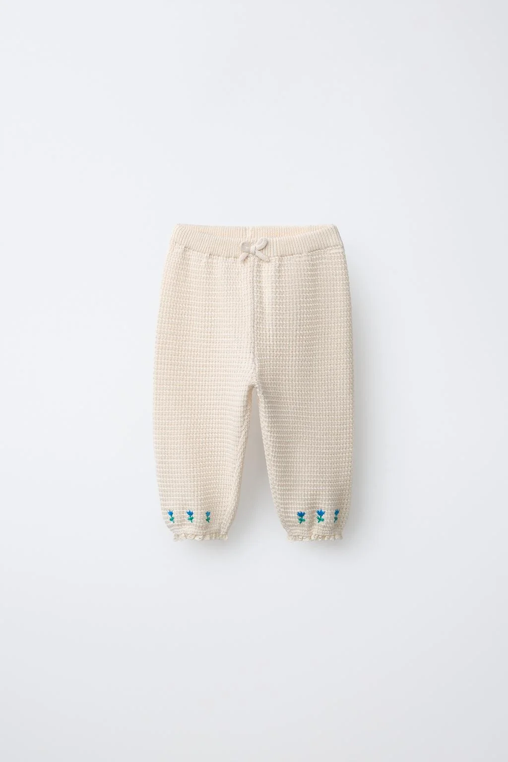 Брюки с вышивкой цветов и кружевной отделкой