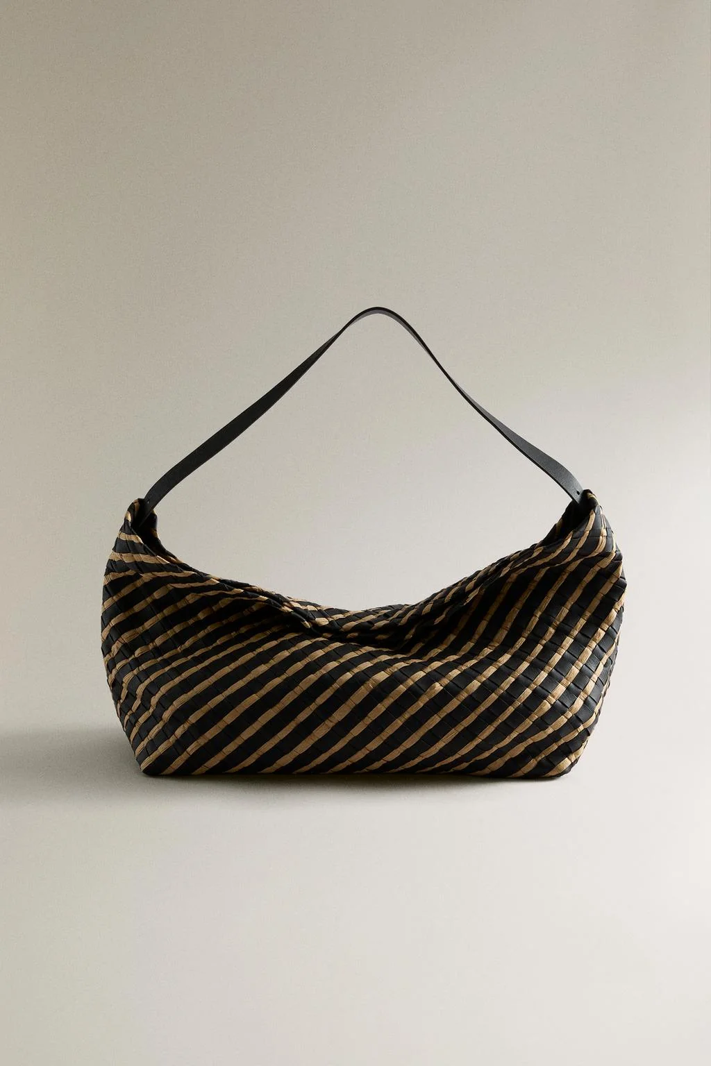 BRAIDED LEATHER CLUTCH