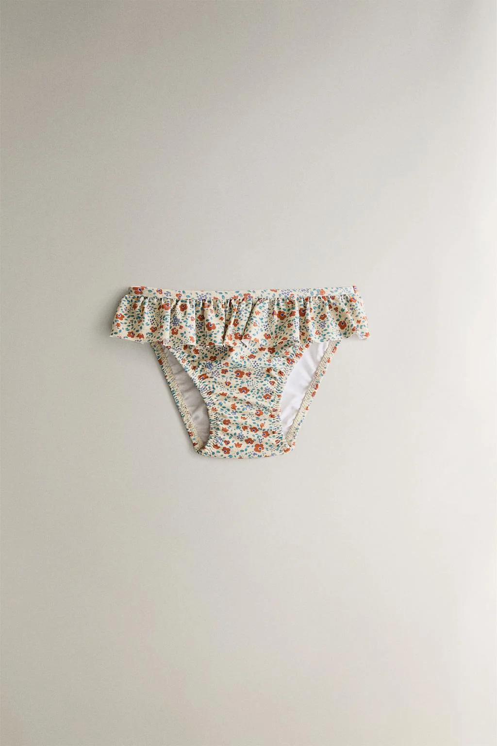 Детские пляжные трусики-бикини в тропический цветочек с оборками