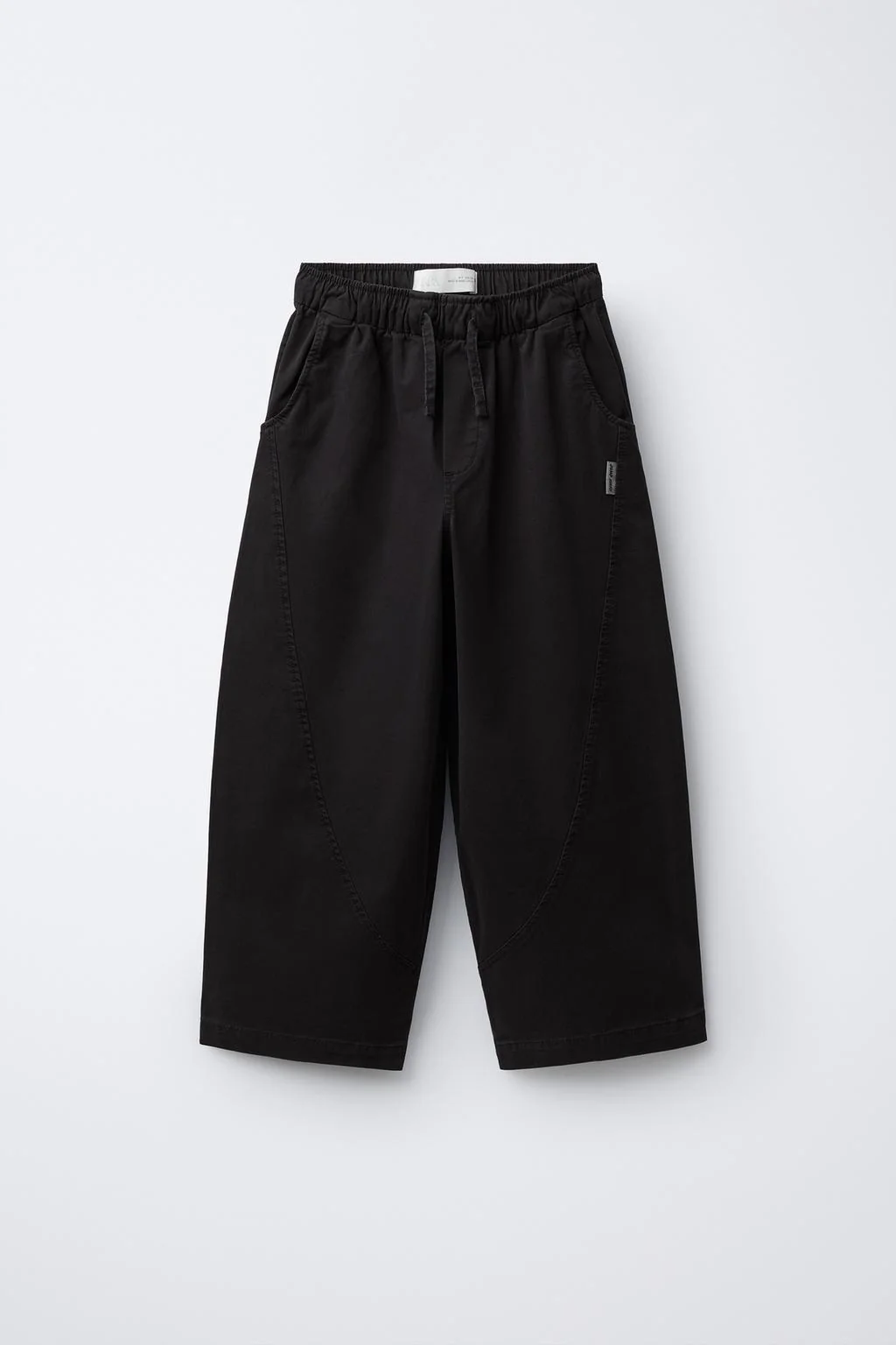 BALLOON TROUSERS WITH CUTS AND LABEL