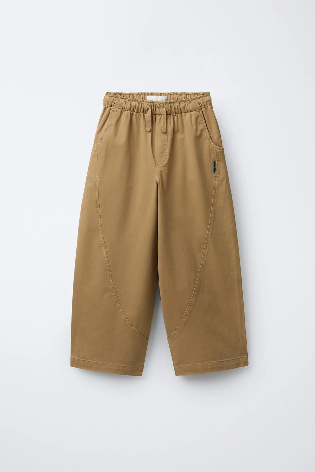 BALLOON TROUSERS WITH CUTS AND LABEL