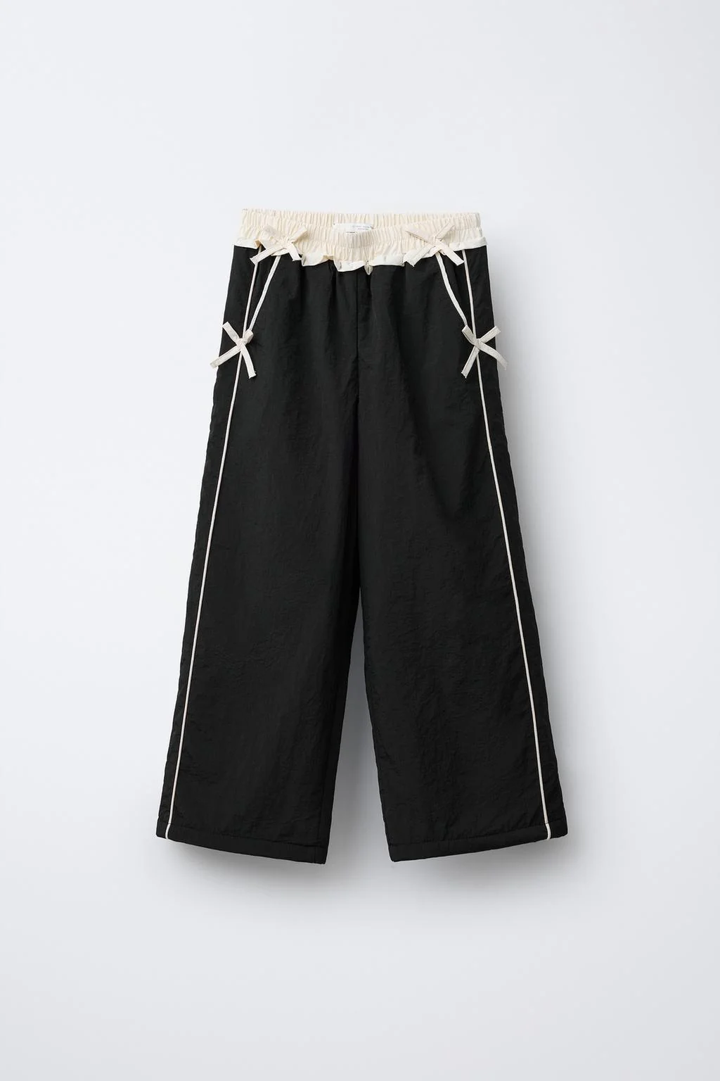 NYLON TROUSERS WITH FLEECE LINING AND BOWS