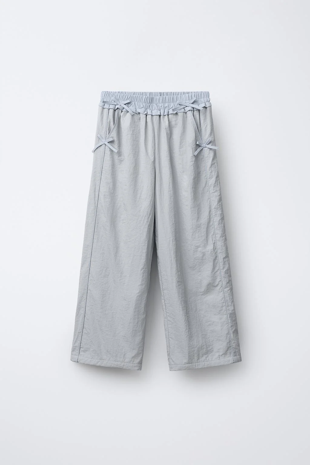 NYLON TROUSERS WITH BOWS AND FLEECE LINING