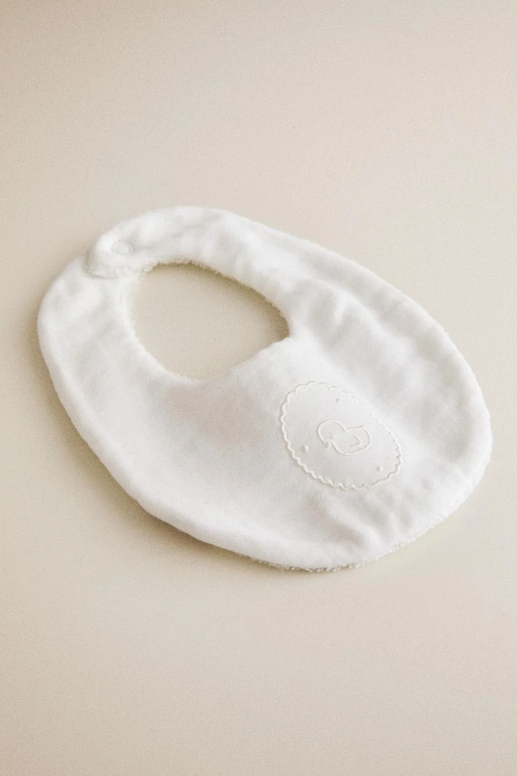 BABY BIB WITH EMBROIDERED CHICK