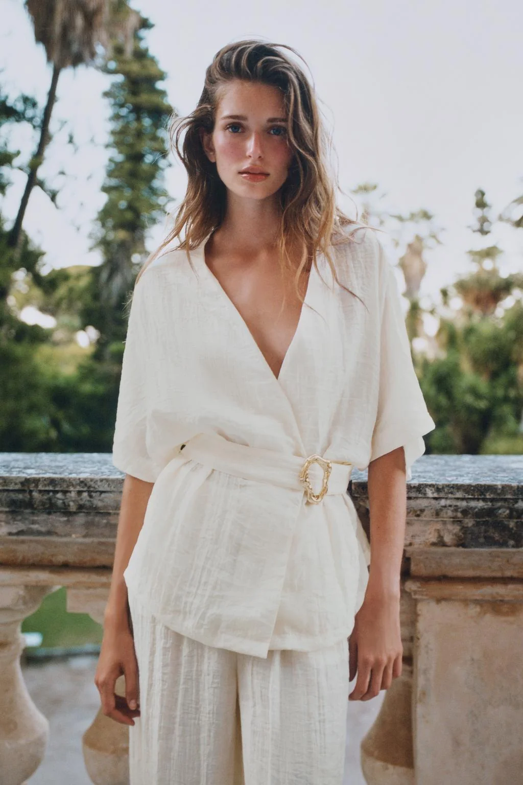 BELTED TOP WITH BUCKLE DETAIL