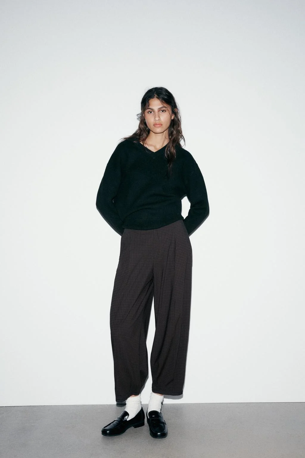 Клетчатые брюки с выточками