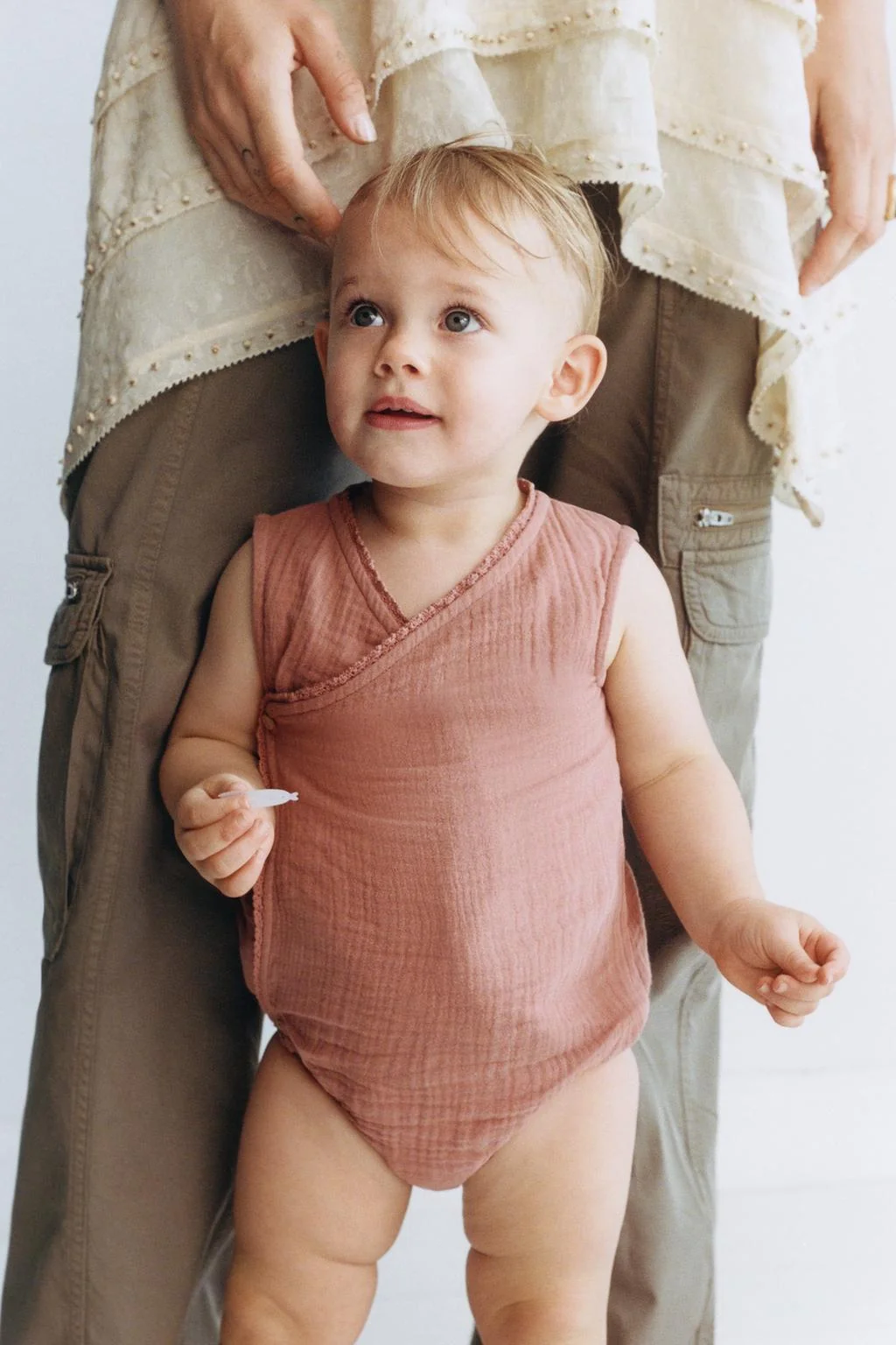 TEXTURED LACE TRIM CROSS-OVER ROMPER