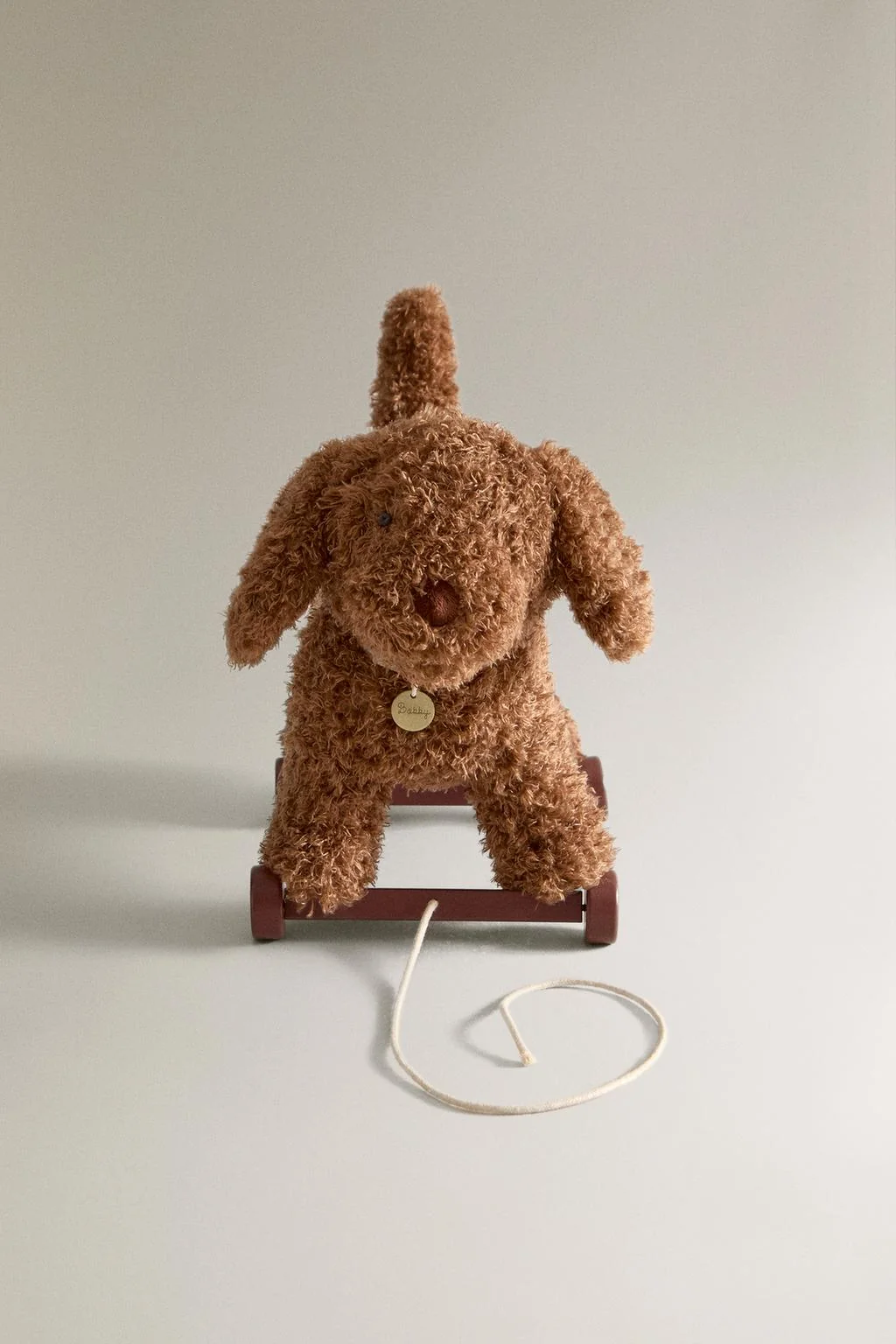 Детская мягкая игрушка-собака на колесах